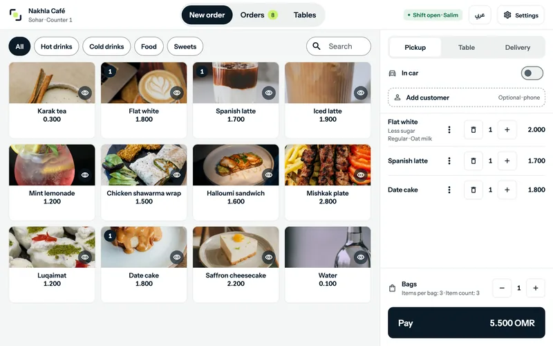 Qalib POS counter on a tablet: menu with photos and a three-item order totalling 5.500 OMR